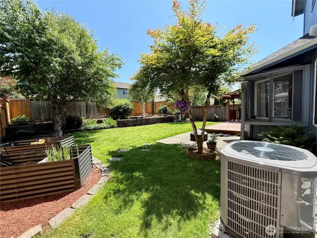 Raised beds, and manicured yard to enjoy.