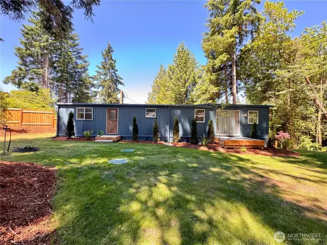 This is the back door view with a small deck off the sliding doors in the living room.