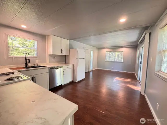 Living room at the back and space for a small dining table.