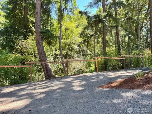 Lighted fencing lines the driveway.