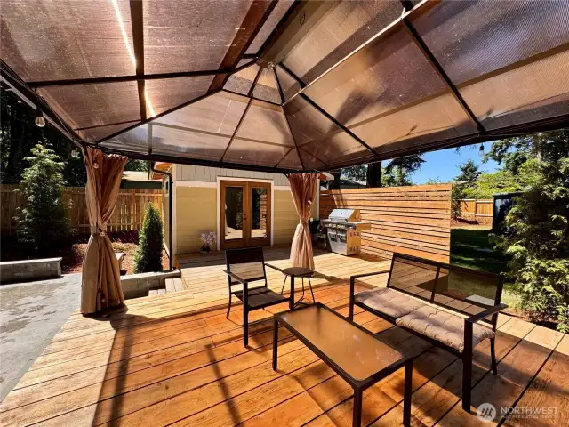 Enjoy the out doors under this covered deck.