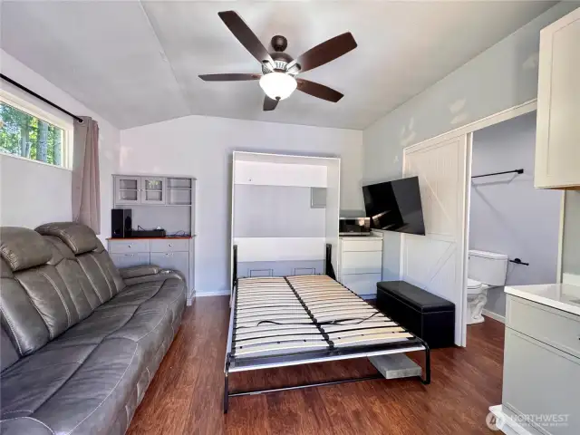 Inside you'll find everything you need. A bathroom, Murphy bed, a sink, toilet, shower, microwave and TV.