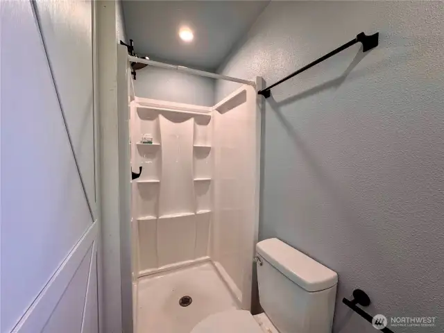 Shower and toilet and sink, everything you need. Just supply the toilet paper.