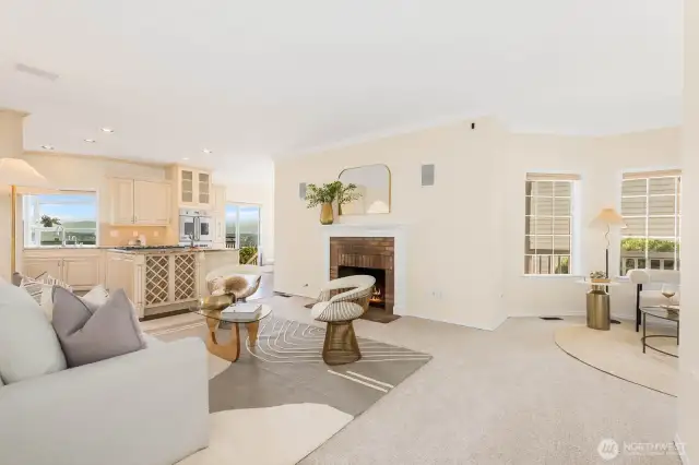 Living room off kitchen with gas fireplace. New carpeting and paint. Built in speaker system as well.