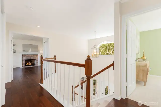 Upstairs hallway with hardwood floors. Laundry closet on your left - located close to the bedrooms.