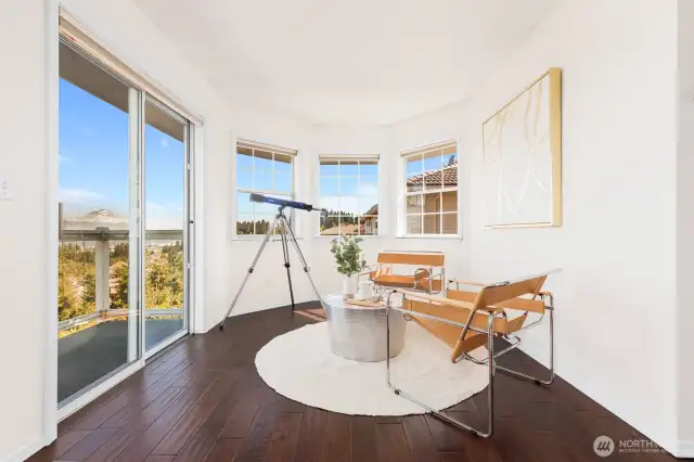 Sitting room in primary with small deck. Perfect spot to start or end your day.