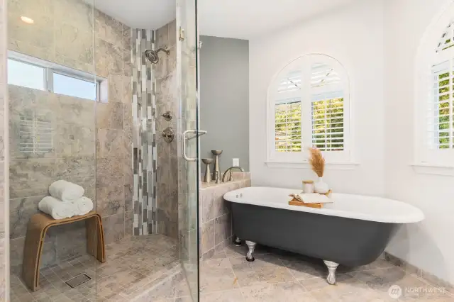 Tub and separate tiled shower.