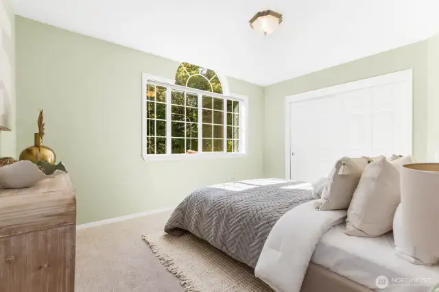 Third bedroom with beautiful windows and new carpeting.