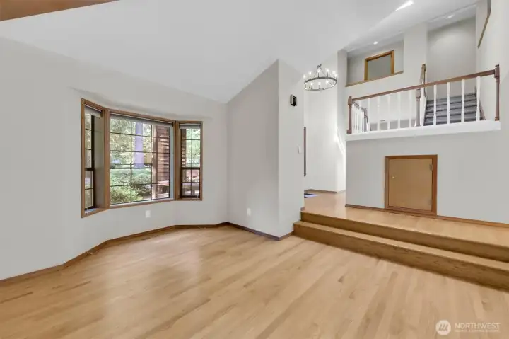 Living Room with bay window and vaulted ceiling.
