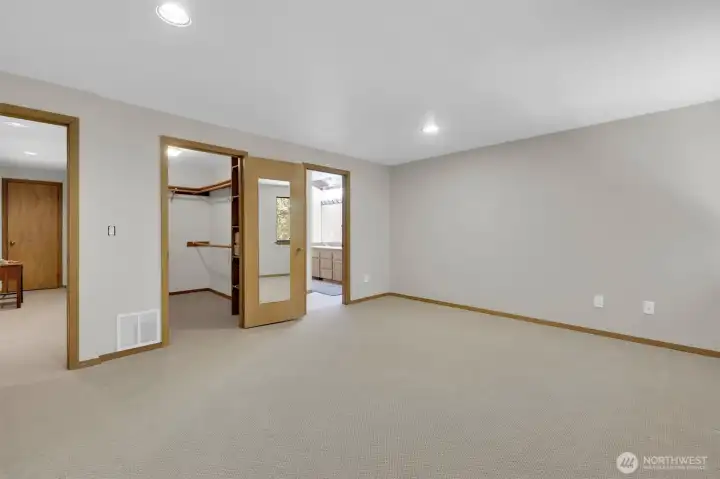 Primary bedroom with walk-in closet and ensuite.