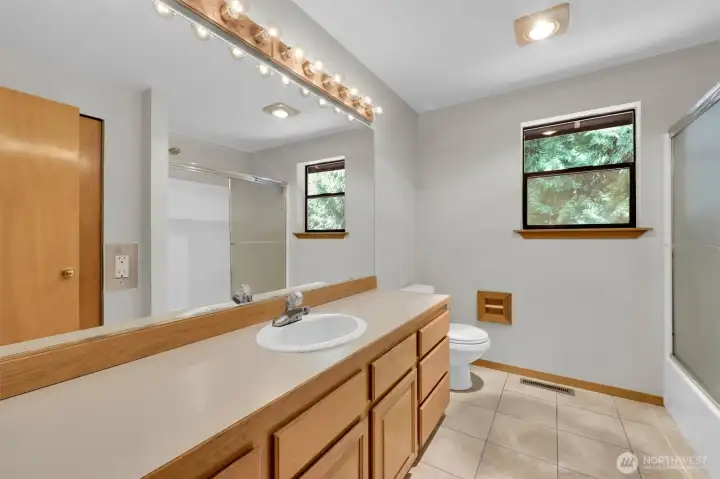 Upstairs hall bath with dual sinks.