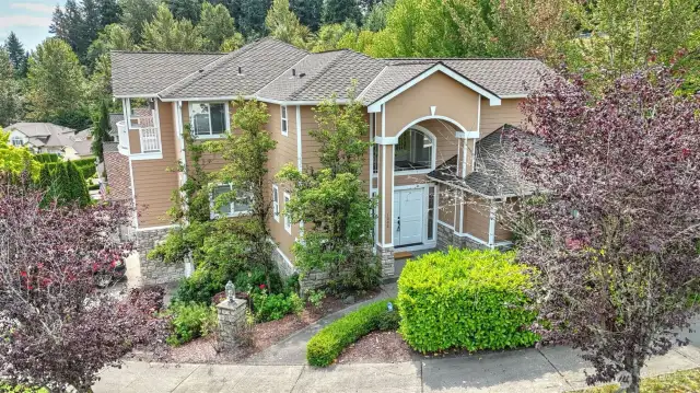 Discover this exquisite multi-level home, perfectly situated on a corner lot in a desirable Auburn neighborhood. The inviting layout features bright, open living spaces filled w/natural light, creating a warm & welcoming atmosphere. A thoughtfully designed kitchen offers ample cabinetry, modern finishes & a seamless flow to the living rm—ideal for entertaining. Upstairs boasts a spacious primary w/en suite, plus 3 guest rooms. Enjoy a main floor office/flex space, and a lower level featuring a large bonus room, guest bath, storage/kitchenette space with wine rack. Endless opportunities w/this spacious layout! Conveniently located near parks, schools, shopping, & major commuter routes, this home combines comfort w/unbeatable accessibility.