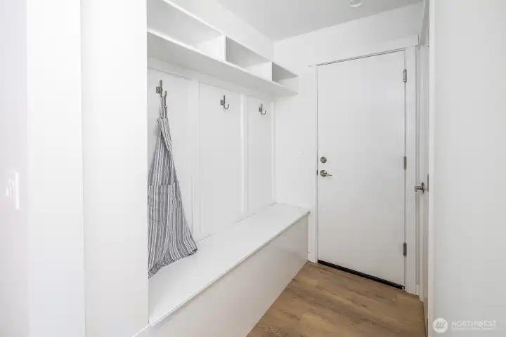 Special built in mud room just off the secure garage entrance fetures shelves, hooks and added storage to keep your home clutter free. Not shown, is extra bonus storage space just opposite the built in mud room bench.