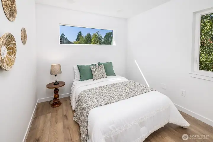 Second top floor bedroom shown here with a queen size bed.  Lots of space for office or study or extra bedroom as shown.