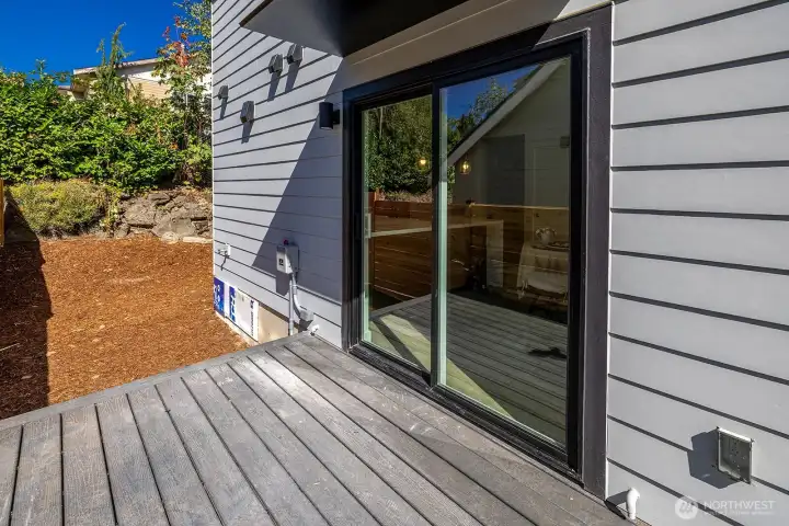 Sweet deck off of the main floor allows easy access to low maintenance yard.  (railings installed 9/15). Ask your broker about additional fencing options.