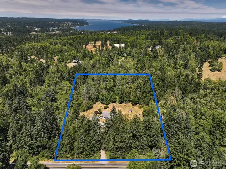 Look at all the forest surrounding you! So private and yet close to Robinson Beach, Double Bluff Beach and Freeland amenities. Enjoy your arrival as you meander down Lancaster Road to your gated driveway.