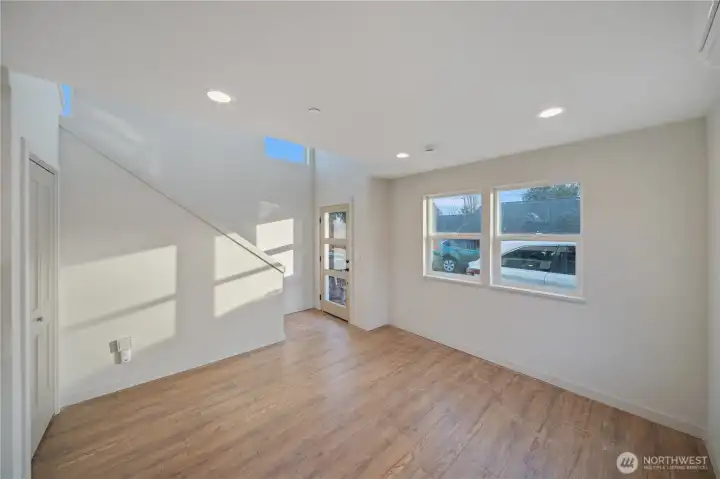 Entry with vaulted ceilings and custom stairs.