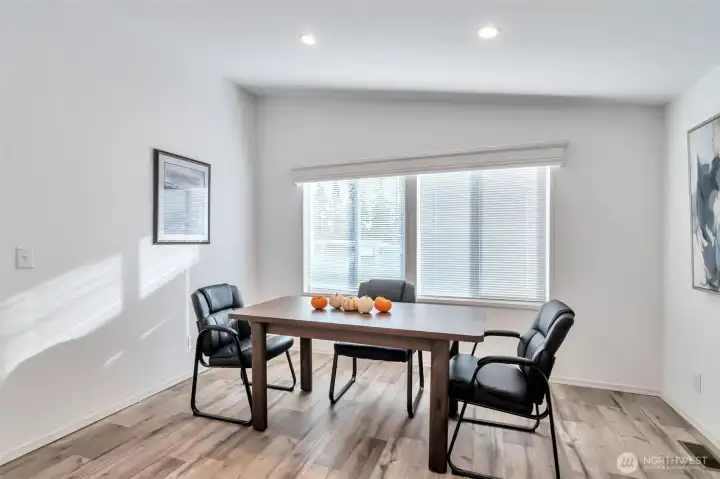 Easy care floors, neutral palette, trim millwork, window coverings throughout.