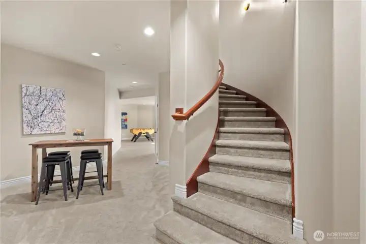 Staircase off the main hall to the lower level.