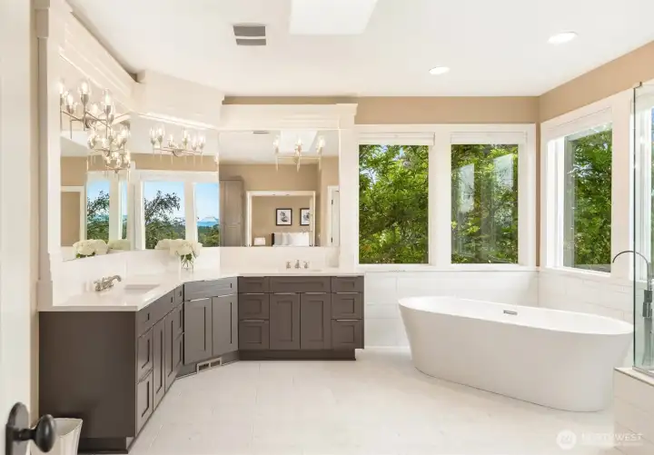 Impressive Master Bath with large mirror and soaking tub