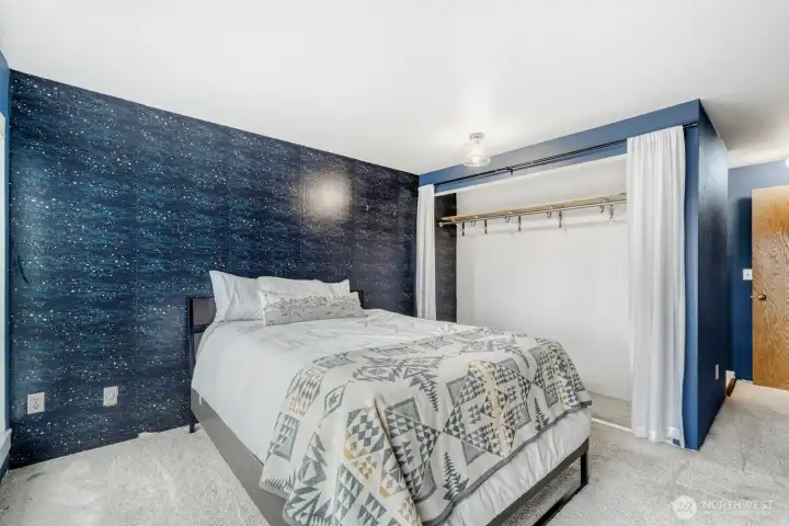 Primary bedroom bathed in natural light.