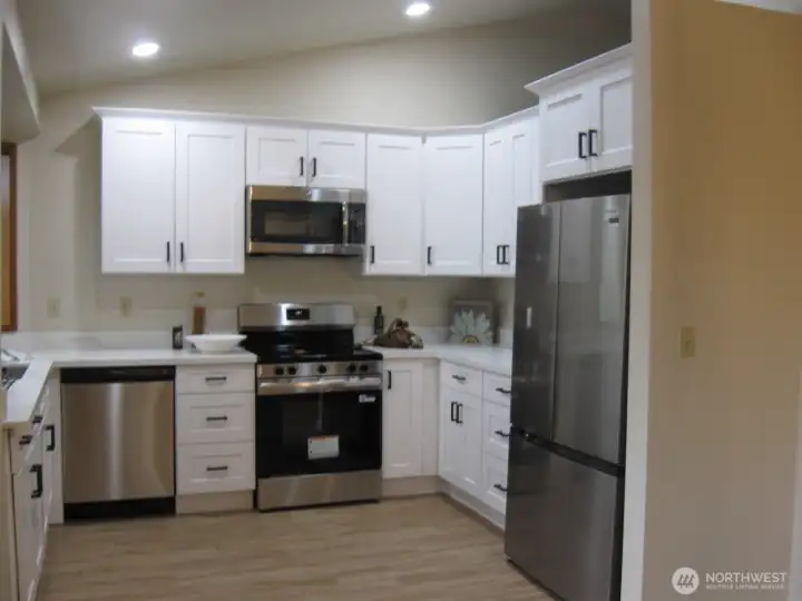 Great kitchen for whipping up your favorite gastronomical delights!  New stainless steel appliances.  Abundant storage and work stations.