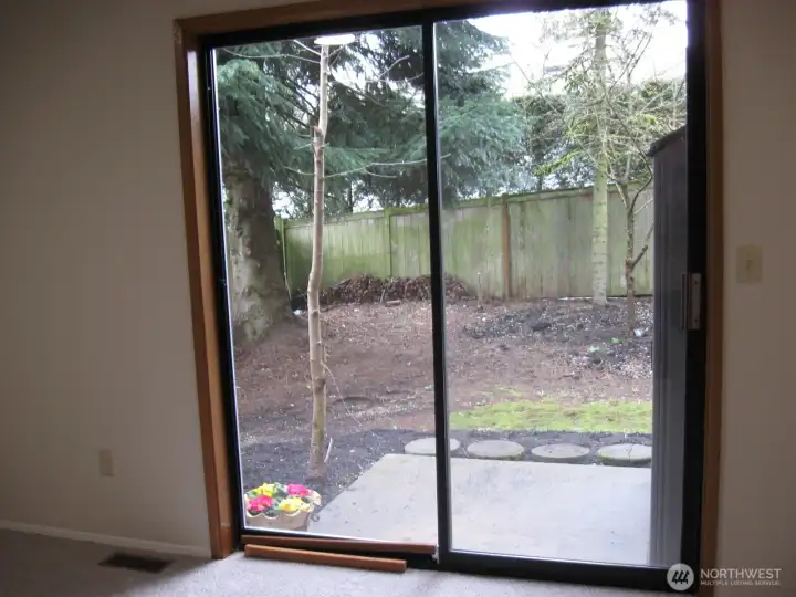Sliders access the backyard patio.