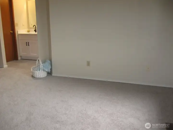 Spacious Primary Bedroom enjoys an en suite Bath and walk in closet.