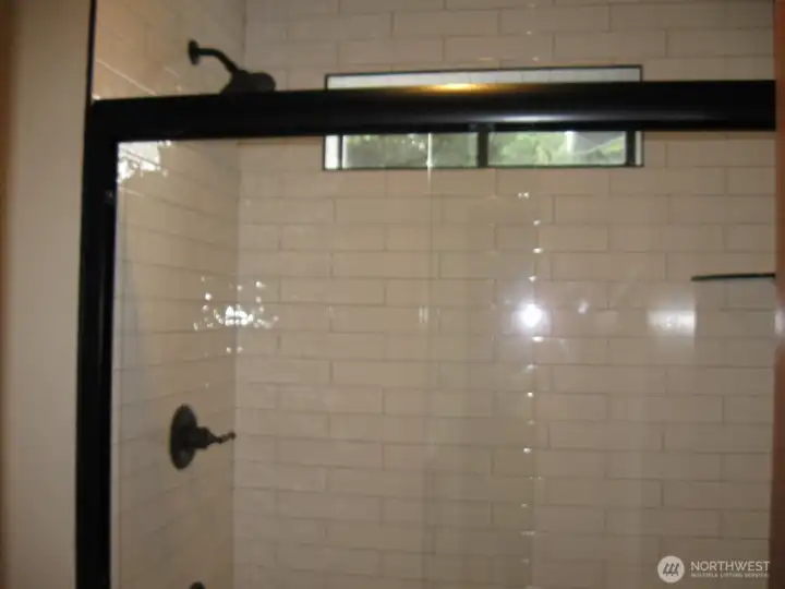 SPECIAL FEATURE:  Gleaming floor to ceiling tile Bath.