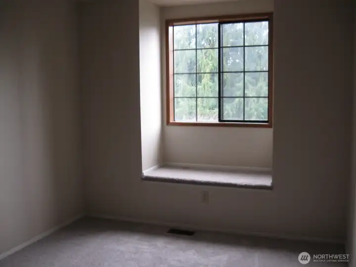 Northwest Bedroom features a window seat.