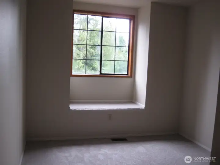 North East Bedroom features a window seat.