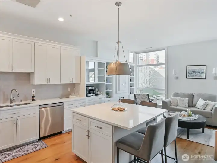 Staged view of Upgraded kitchen w/extended island that seats 4. Staged prior to Seller move out.