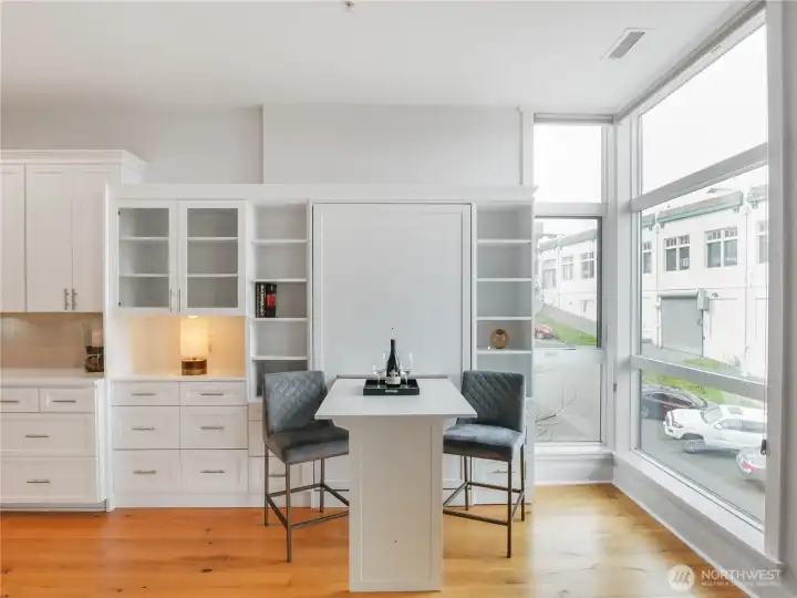 View of Murphy bed that converts to multiple use table/desk/workspace/dining.
