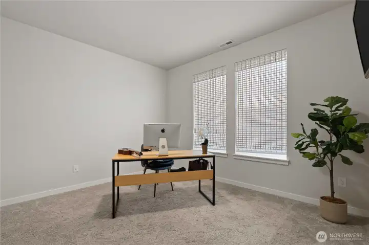 main floor office/bedroom with closet