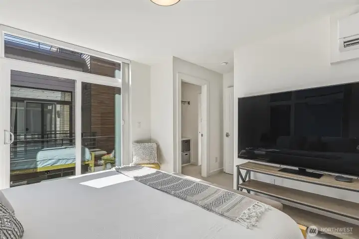 Walk-in closet off the primary bedroom leads to the bathroom