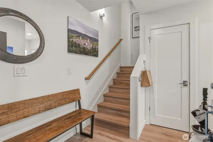First level foyer can accommodate a bench, and features a coat closet