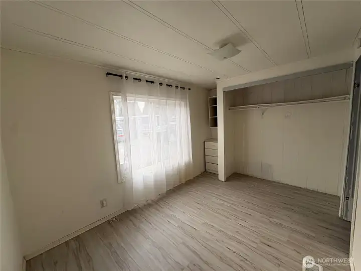 Second view of guest bedroom with built in dresser