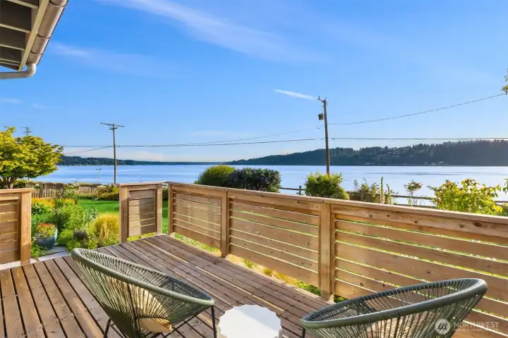 The west-facing deck off of the dining room. There is easy access from inside to the outdoors all through this home. The west-facing deck off of the dining room. There is easy access from inside to the outdoors all through this home.