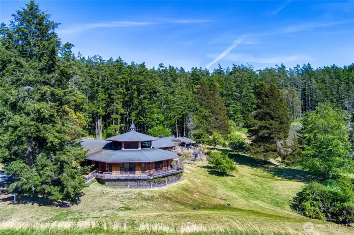 Main home and ponds to entrance