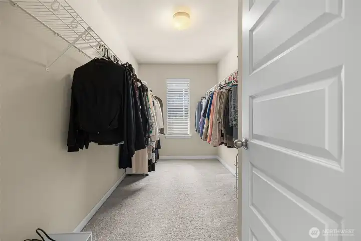 Large walk-in closet in primary Large walk-in closet in primary