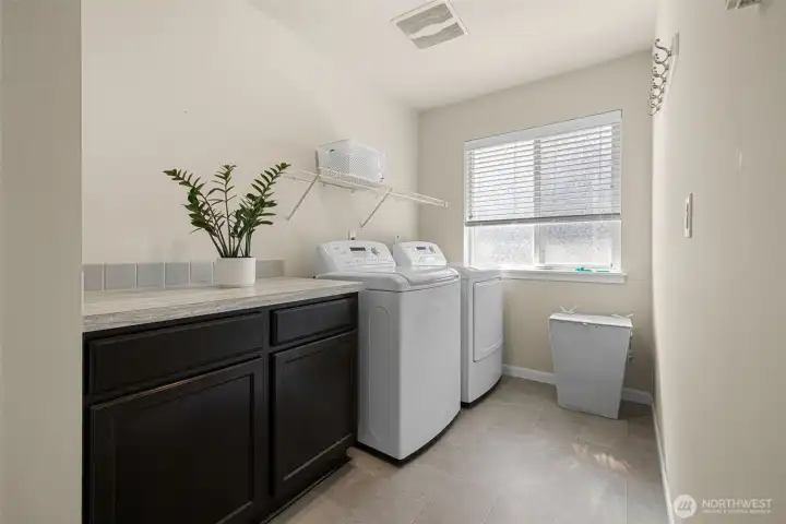 Laundry room with cabinets and counter space Laundry room with cabinets and counter space