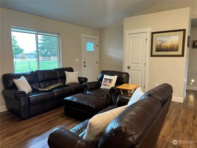 Living room with coat closet.