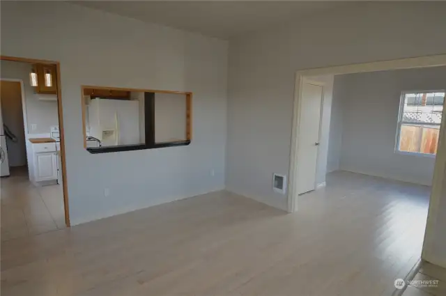 Living room (facing flex room/additional bedroom with closet.