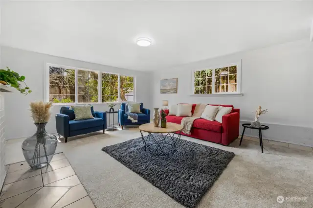 Downstairs rec room, family room. Used as a fifth bedroom in the past.