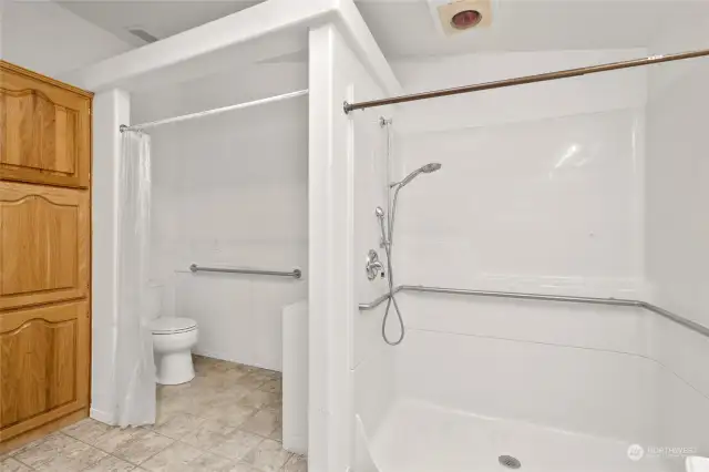 Primary Suite- The shower is so big! Note the extra wall of cabinetry storage here too.