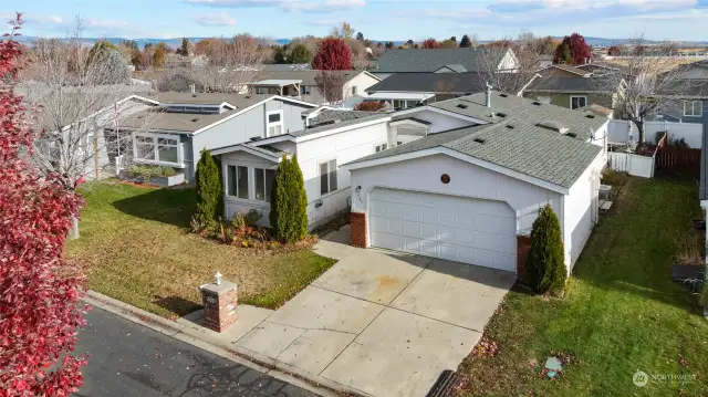 Another view showing the home and driveway.