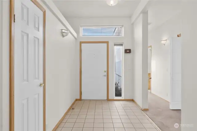 Nice tiled entry with coat closet.