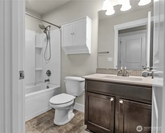 Well-appointed full bath conveniently located near the bedrooms and laundry is just down the hall.