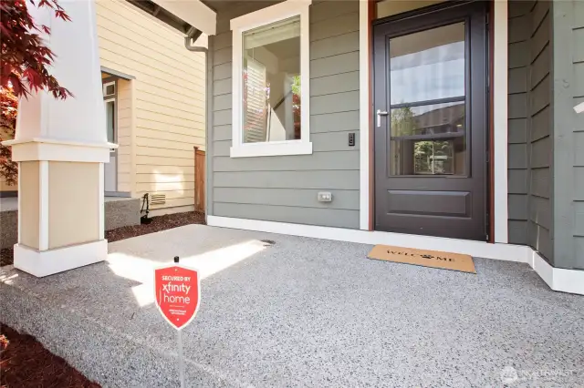 Start your welcome home experience with a beautiful washed aggregate cement front porch.