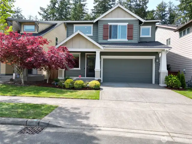 Well-kept cement driveway and sidewalks add to the home’s clean and polished curb appeal. Is this your new address?